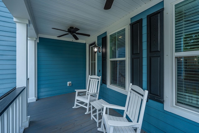 wooden deck with a porch and a ceiling fan