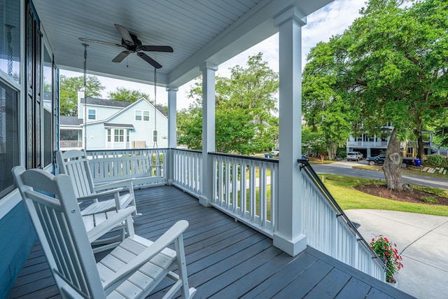 deck with a porch and a ceiling fan