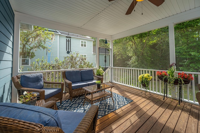 wooden terrace featuring a ceiling fan and an outdoor hangout area