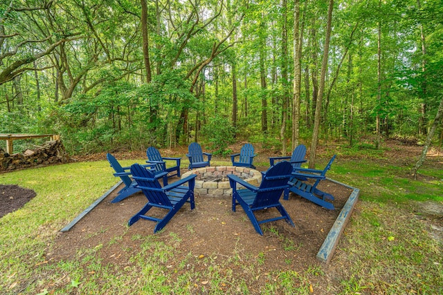 view of yard featuring an outdoor fire pit