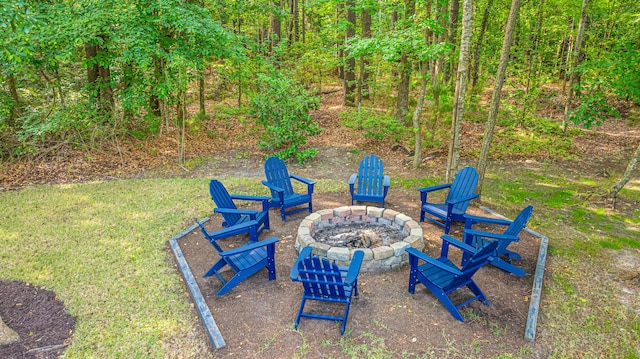 view of yard with a fire pit