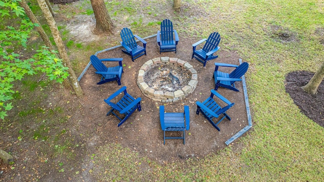 view of yard with an outdoor fire pit