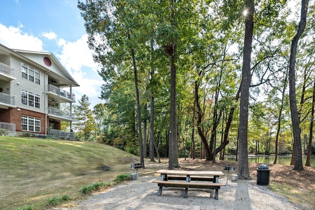 view of home's community with a yard