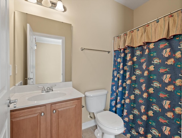 bathroom featuring toilet, walk in shower, vanity, and tile patterned floors