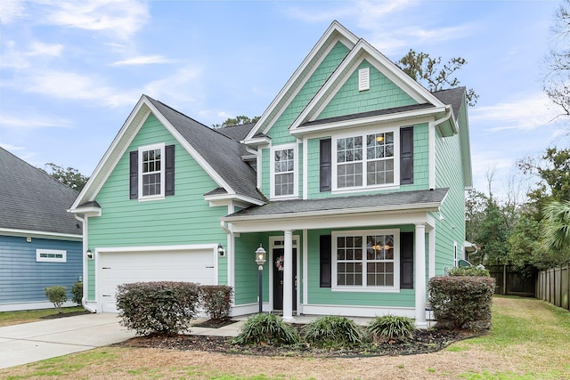 view of front of property featuring an attached garage, driveway, fence, and roof with shingles