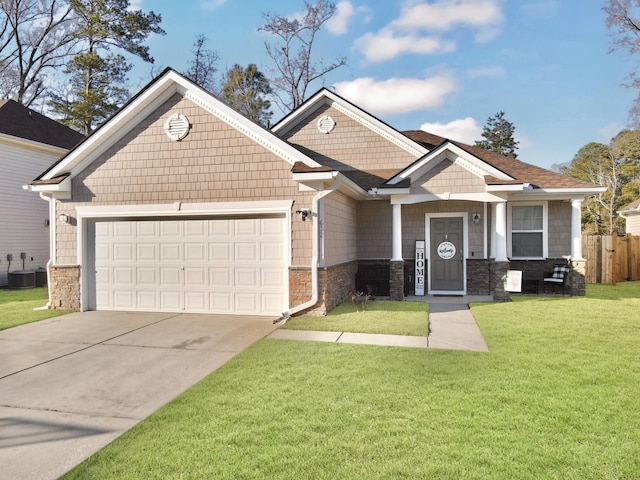 craftsman house featuring a garage, concrete driveway, stone siding, cooling unit, and a front lawn