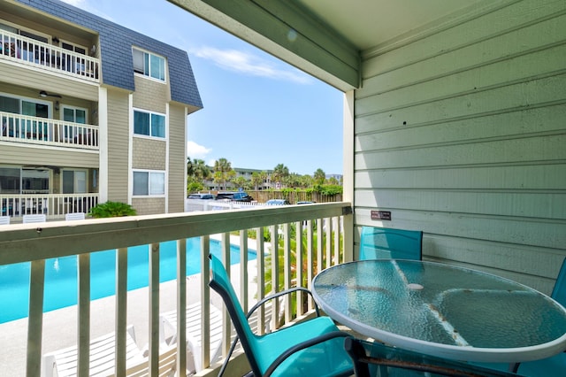 1400 Ocean Blvd Unit 106B, Isle Of Palms, SC 29451 - balcony featuring outdoor dining space and view of pool
