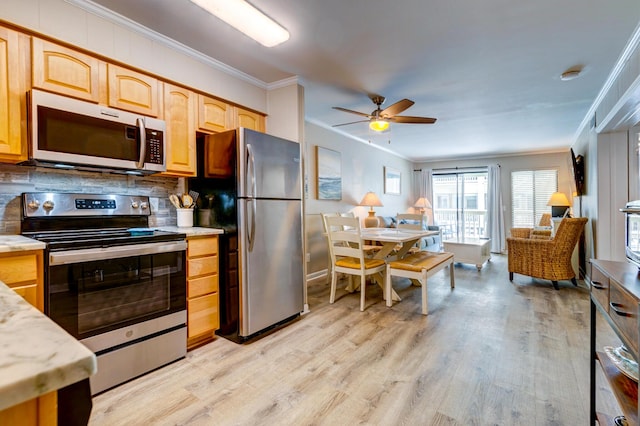 1400 Ocean Blvd Unit 106B, Isle Of Palms, SC 29451 - kitchen featuring stainless steel appliances, ornamental molding, light wood finished floors, a ceiling fan, and tasteful backsplash