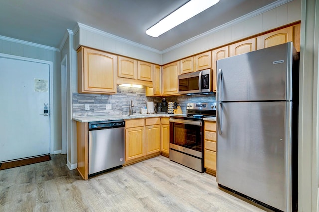 1400 Ocean Blvd Unit 106B, Isle Of Palms, SC 29451 - kitchen featuring stainless steel appliances, light brown cabinetry, ornamental molding, light wood-type flooring, and decorative backsplash