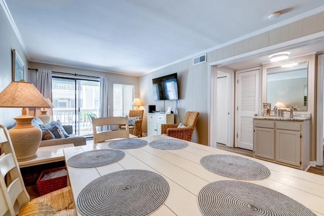 1400 Ocean Blvd Unit 106B, Isle Of Palms, SC 29451 - dining area featuring ornamental molding