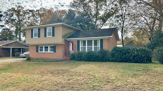 tri-level home with a front yard