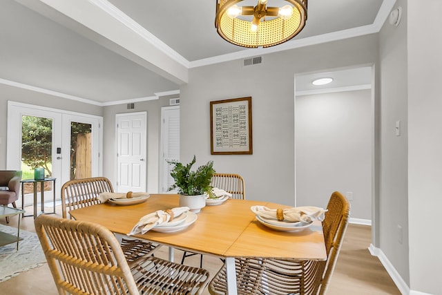 2362 Parsonage Rd Unit 2H, Charleston, SC 29414 - dining space featuring french doors, crown molding, light wood-style flooring, and a chandelier