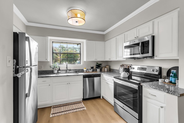 2362 Parsonage Rd Unit 2H, Charleston, SC 29414 - kitchen featuring appliances with stainless steel finishes, crown molding, light wood-style flooring, white cabinets, and stone counters