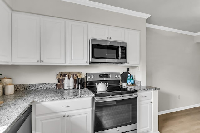 2362 Parsonage Rd Unit 2H, Charleston, SC 29414 - kitchen with appliances with stainless steel finishes, white cabinets, ornamental molding, and wood finished floors