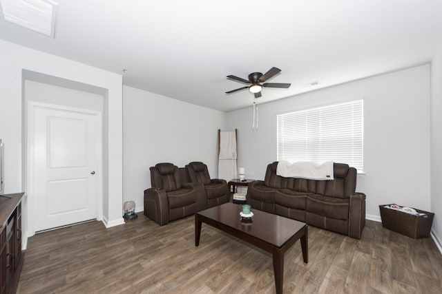 living room with ceiling fan and dark hardwood / wood-style floors