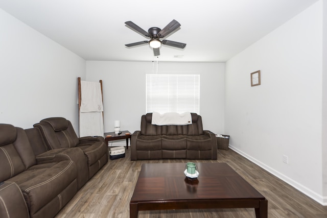 living room with ceiling fan and hardwood / wood-style flooring