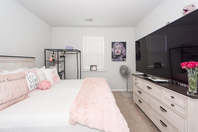 bedroom featuring light colored carpet