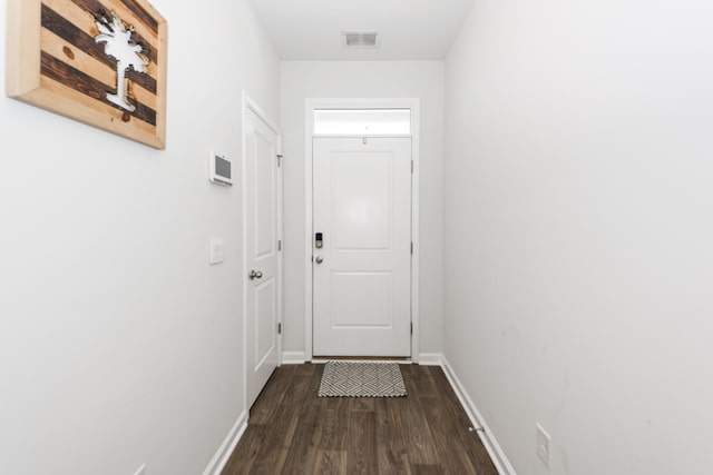 doorway with dark hardwood / wood-style flooring