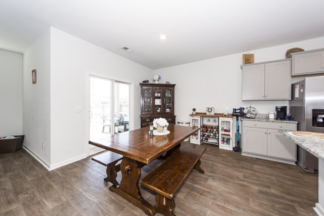 dining area featuring dark hardwood / wood-style flooring