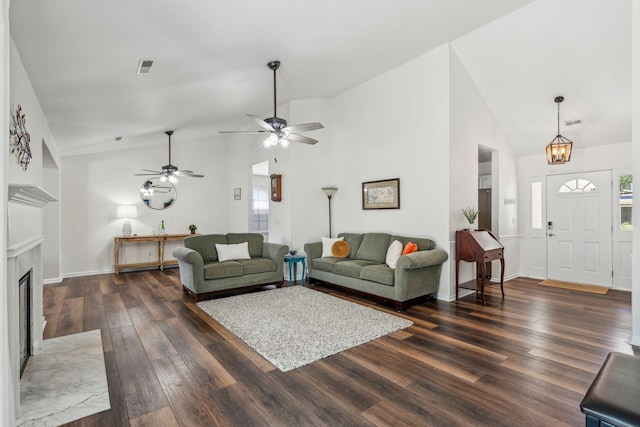 1027 Wayfarer Ln, Charleston, SC 29412 - living room with wood finished floors, high vaulted ceiling, a fireplace, ceiling fan, and baseboards