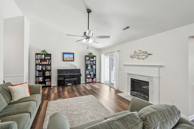 1027 Wayfarer Ln, Charleston, SC 29412 - living area featuring lofted ceiling, ceiling fan, a premium fireplace, dark wood-style flooring, and baseboards