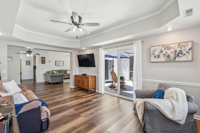 1027 Wayfarer Ln, Charleston, SC 29412 - living area featuring a raised ceiling, ceiling fan, wood finished floors, ornamental molding, and baseboards