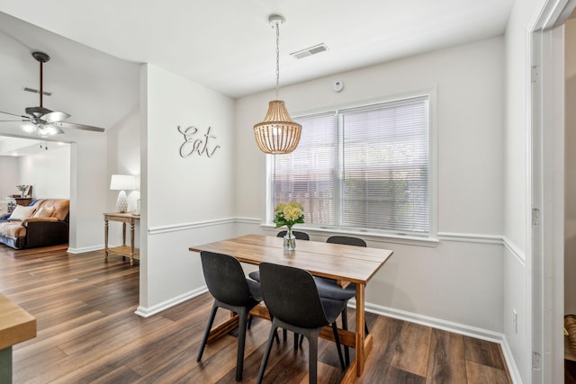1027 Wayfarer Ln, Charleston, SC 29412 - dining space with dark wood-style flooring, baseboards, and a ceiling fan