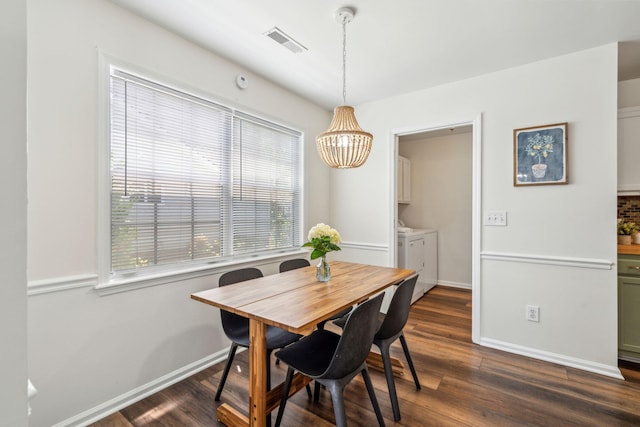 1027 Wayfarer Ln, Charleston, SC 29412 - dining area featuring washing machine and dryer, a chandelier, baseboards, and healthy amount of natural light