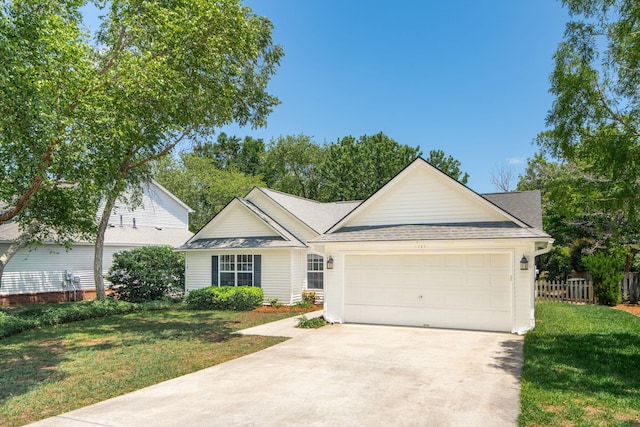 1027 Wayfarer Ln, Charleston, SC 29412 - view of front of house featuring an attached garage, driveway, and a shingled roof