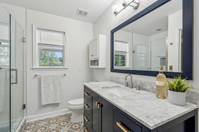 1027 Wayfarer Ln, Charleston, SC 29412 - bathroom with toilet, vanity, a shower stall, tile patterned floors, and baseboards