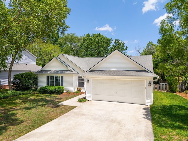 1027 Wayfarer Ln, Charleston, SC 29412 - view of front facade featuring an attached garage, concrete driveway, and a shingled roof