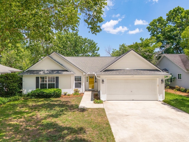 1027 Wayfarer Ln, Charleston, SC 29412 - view of front of property with an attached garage, driveway, a front lawn, and a shingled roof