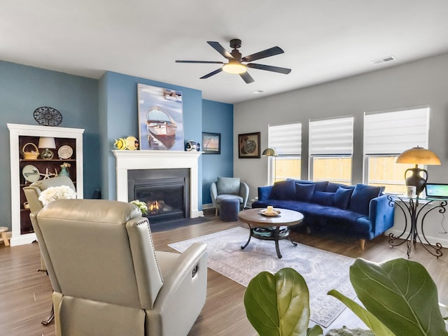 living room featuring hardwood / wood-style flooring and ceiling fan