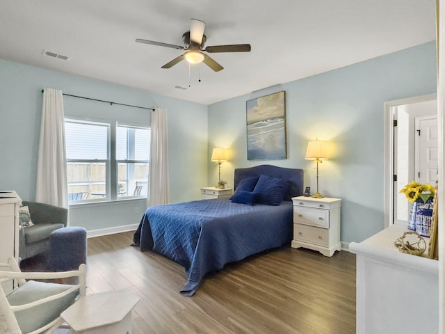 bedroom with dark wood-type flooring and ceiling fan