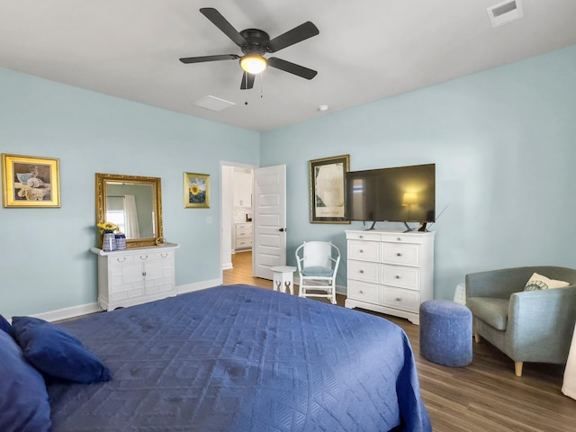 bedroom with ceiling fan and hardwood / wood-style floors