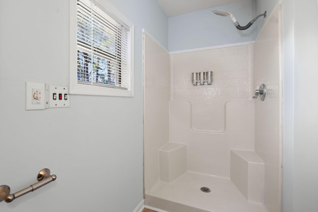 bathroom featuring a shower stall