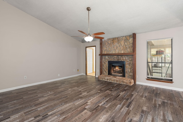 unfurnished living room featuring a fireplace, baseboards, vaulted ceiling, and dark wood-style flooring