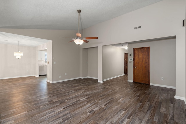 spare room with ceiling fan with notable chandelier, dark wood-type flooring, visible vents, and baseboards