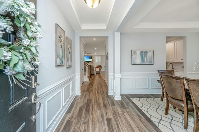 foyer featuring dark hardwood / wood-style floors and ornamental molding