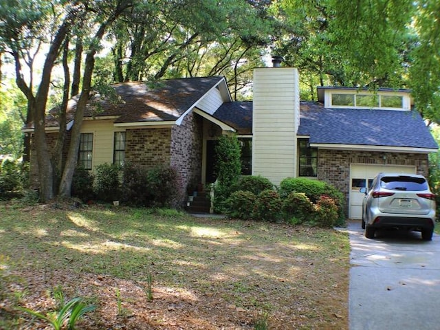 20 Anderson Ave, Charleston, SC 29412 - view of front facade with an attached garage, a chimney, brick siding, driveway, and roof with shingles