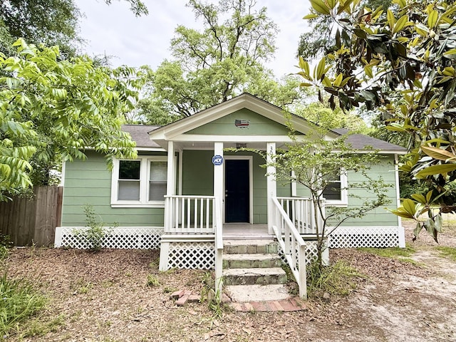 307 Mill St, Walterboro, SC 29488 - view of front facade with a porch, roof with shingles, and fence