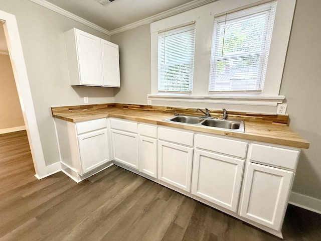307 Mill St, Walterboro, SC 29488 - kitchen featuring a sink, butcher block counters, baseboards, and wood finished floors