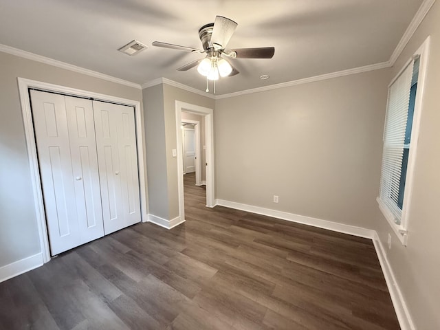 307 Mill St, Walterboro, SC 29488 - unfurnished bedroom featuring baseboards, crown molding, visible vents, and dark wood-style floors