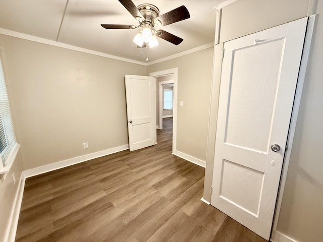 307 Mill St, Walterboro, SC 29488 - unfurnished bedroom featuring ceiling fan, wood finished floors, baseboards, and ornamental molding