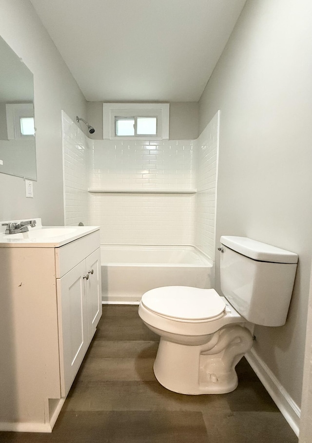 307 Mill St, Walterboro, SC 29488 - bathroom with toilet, vanity, shower / washtub combination, and wood finished floors