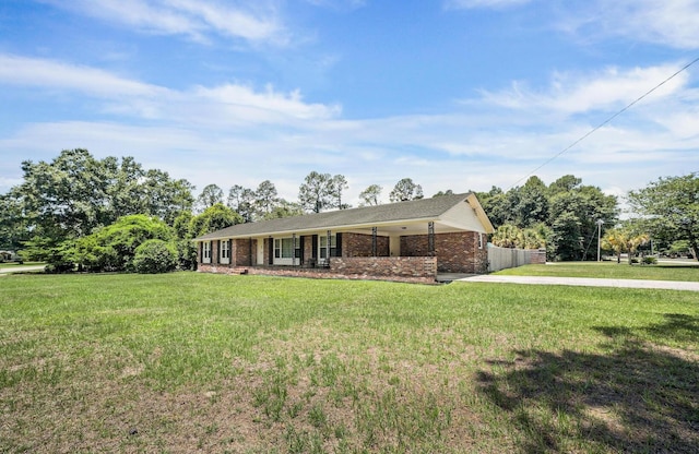 ranch-style house with a front lawn