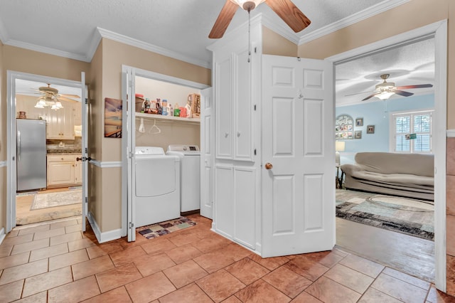 washroom featuring ornamental molding, ceiling fan, and a textured ceiling