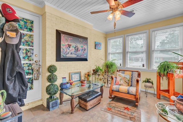 sunroom / solarium with ceiling fan, a wealth of natural light, and wood ceiling