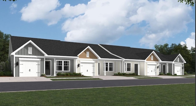 view of front of property with a garage, board and batten siding, and a front yard