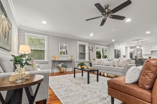 1211 Dennis Blvd, Moncks Corner, SC 29461 - living room with recessed lighting, plenty of natural light, wood finished floors, ornamental molding, and ceiling fan